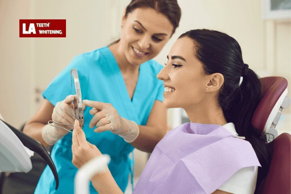 A dentist providing aftercare instructions for maintaining lazer teeth whitening results Windsor